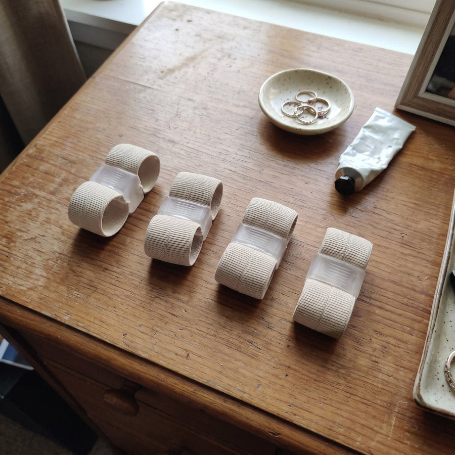 Four Askelo correctors on a wooden dresser